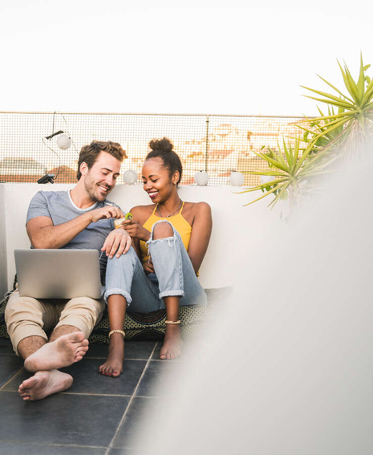 Couple outside on computer