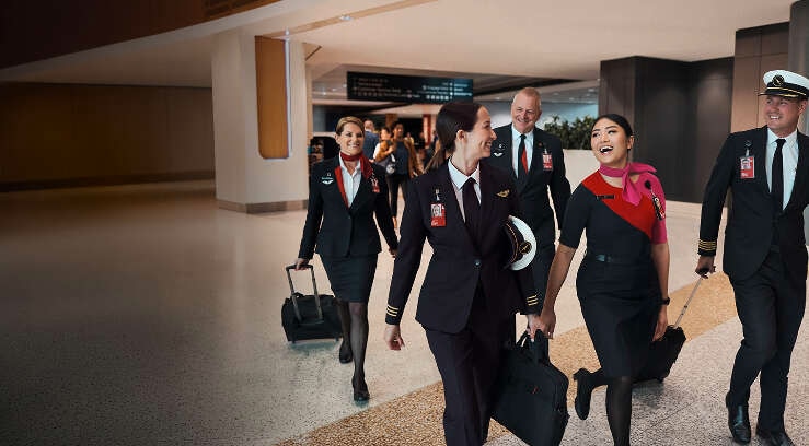 Qantas crew walking through terminal