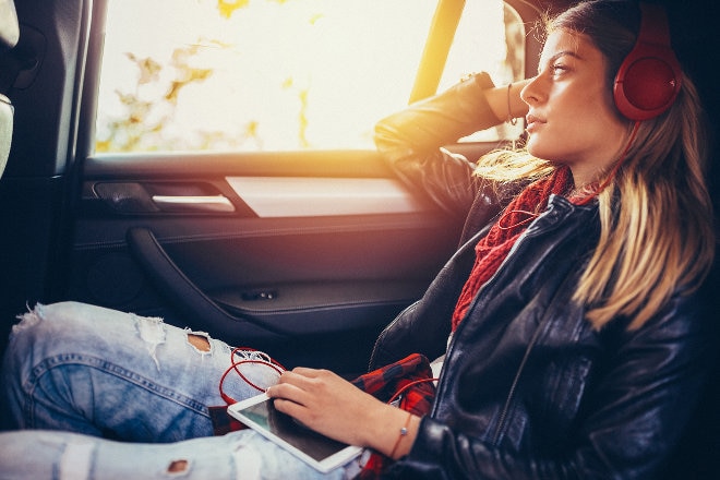 Girl in car looking out the window