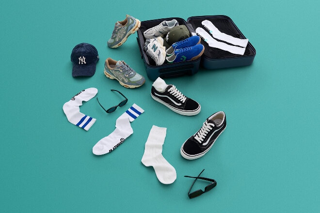 Aerial flatlay of Platypus shoes, socks and accessories