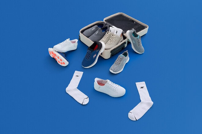 Aerial flatlay of Skechers shoes, socks and accessories