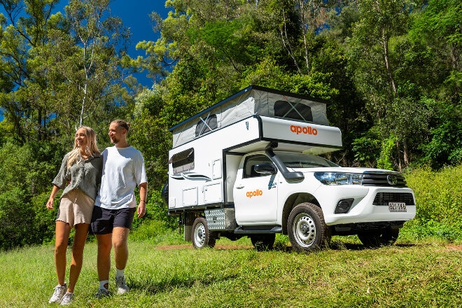 Couple enjoying a stroll in native bush during an Apollo holiday