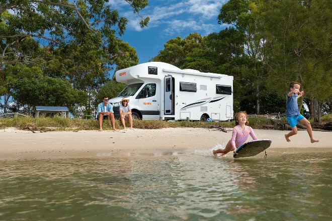 Family enjoying swimming at a rest stop on their Apollo holiday