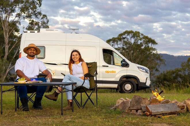 A couple enjoying a rest stop on their Apollo camper holiday