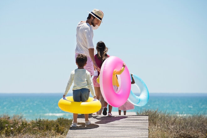 Family walking to the beach