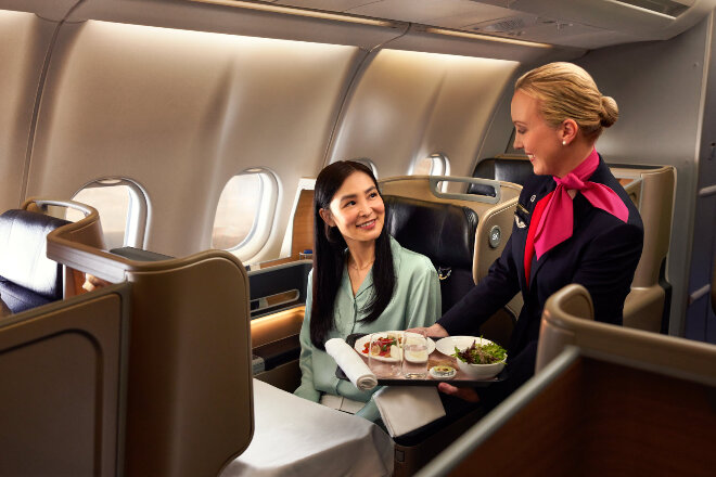 Passenger enjoys inflight dining service in Business