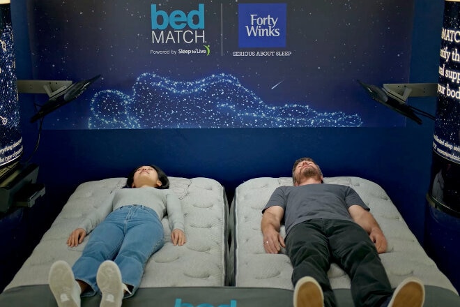 People trying out the bedMATCH technolog in-store