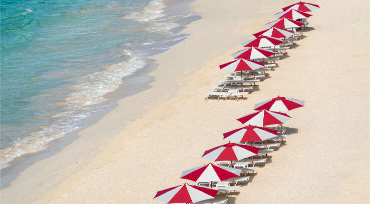 Red and white beach umbrellas