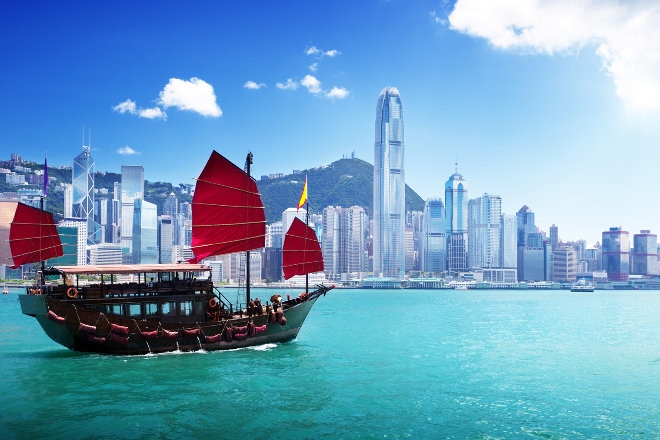 Hong Kong skyline with junk sailing past