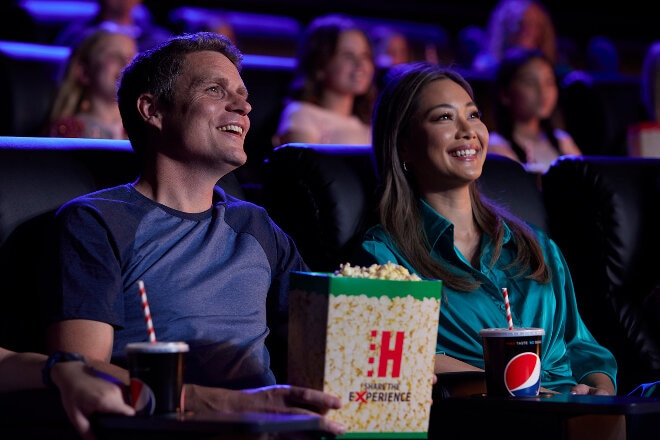 couple laughing and enjoying the movie