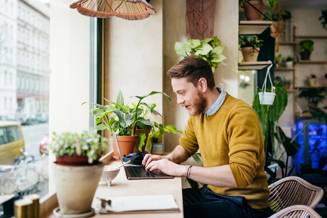 Person at a desk using a laptop