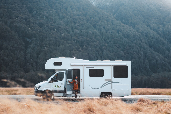 Mighty motorhome parked near alpine bushland