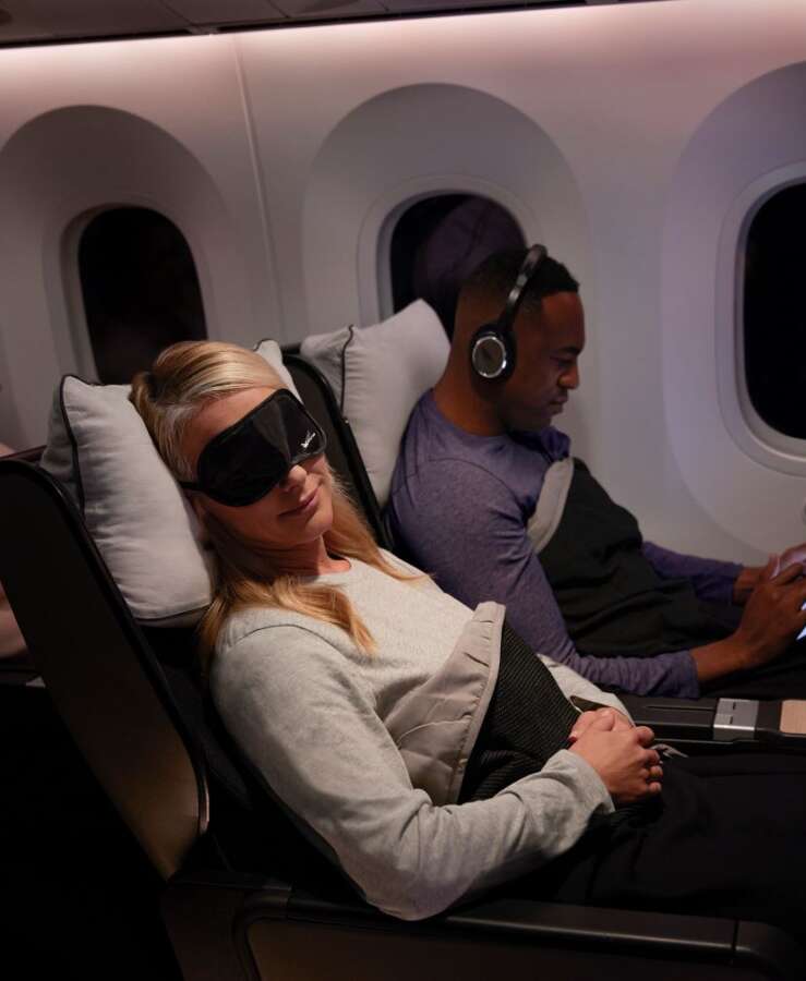 Passenger sleeping onboard Qantas Boeing 787 Premium Economy