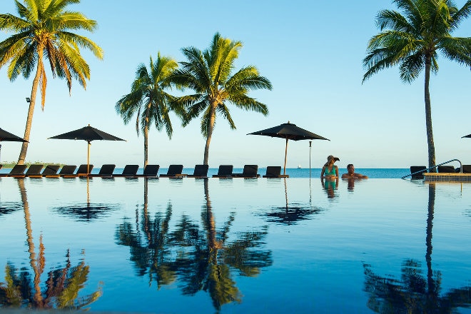 Couple in poolside at the Hilton