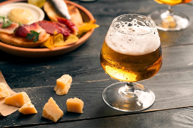 Beer in a glass and snacks