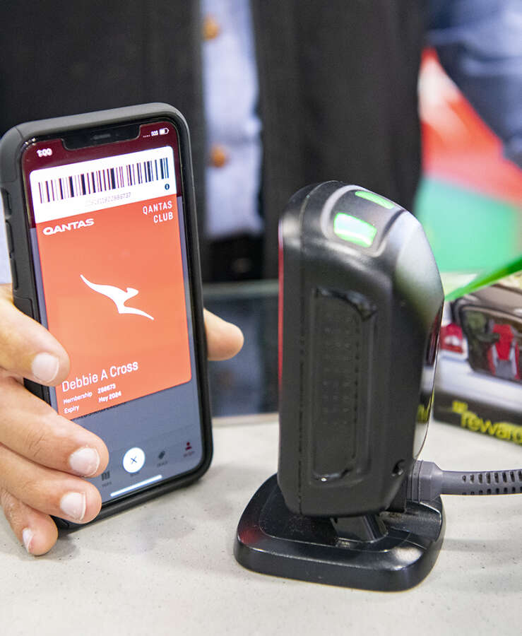 Member scanning a digital Qantas Frequent Flyer card