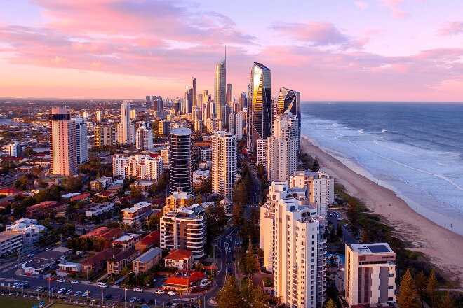 Sunset over Surfers Paradise high rise buildings and beach