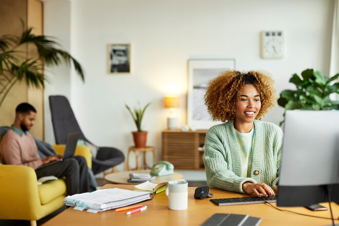 Woman using laptop at home