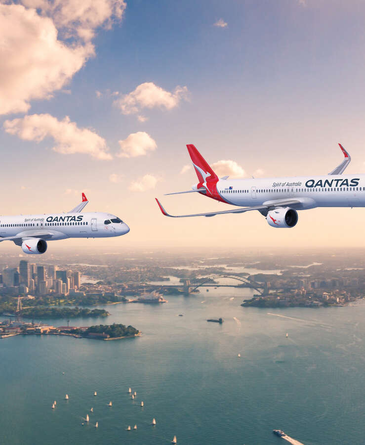 Qantas A220 and A321 aircraft flying over Sydney Harbour