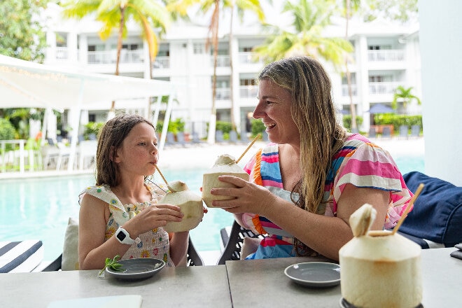 Jade enjoying coconut drink with daughter a Queensland hotel