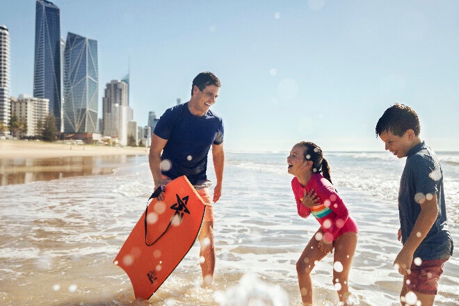 Kids and dad on Surfers Paradise Beach