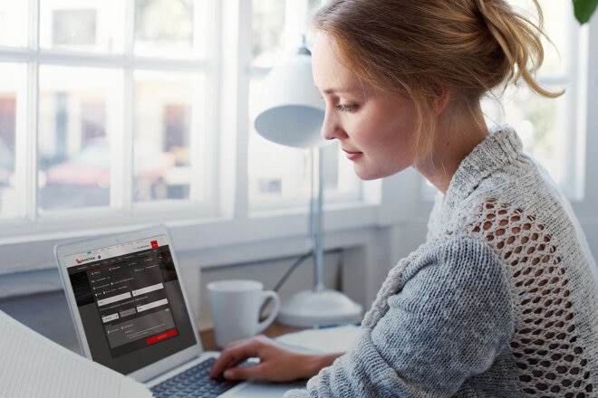 Woman at desk on her laptop