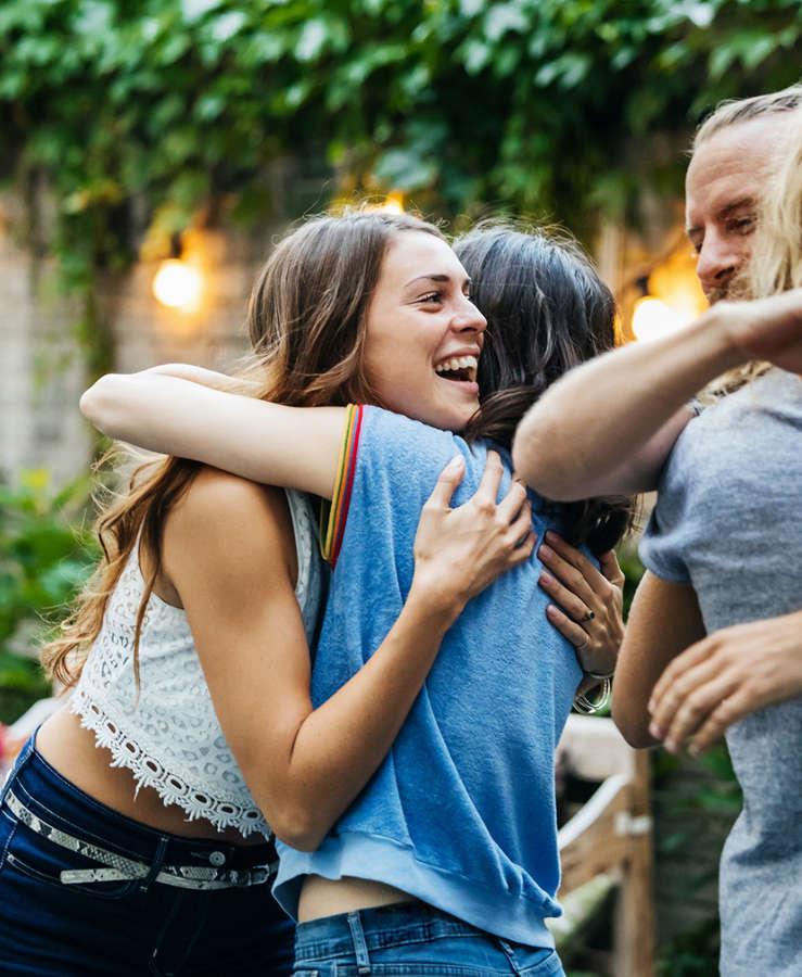 Friends and family hugging