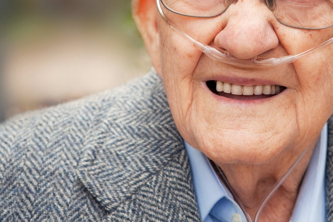 Elderly man using oxygen