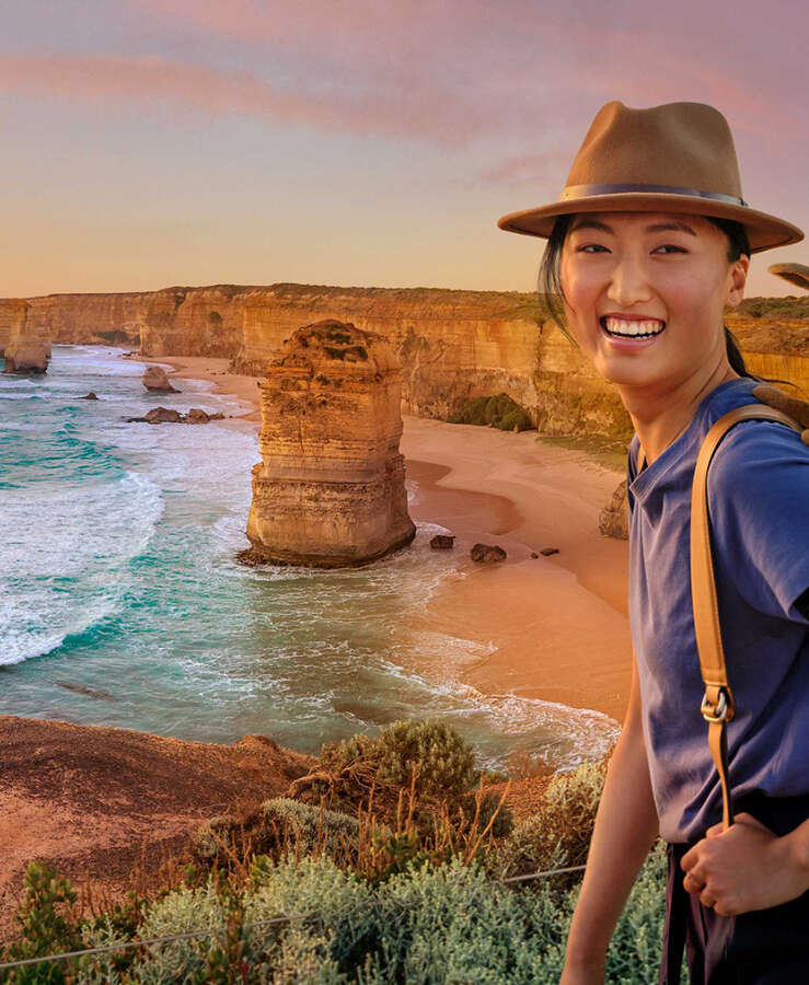 A girl running by the Twelve Apostles in Victoria