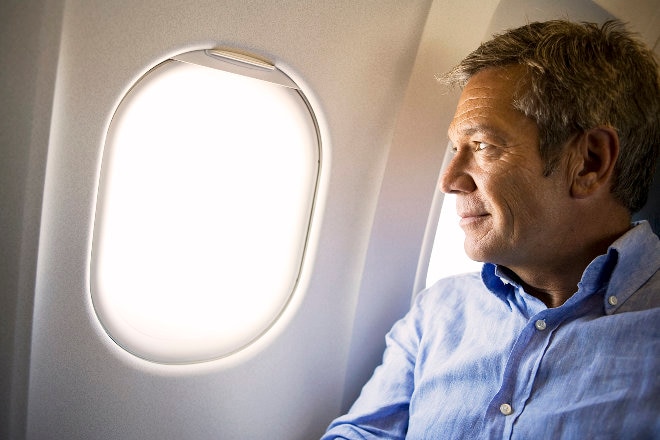 Man looking out of aircrat window