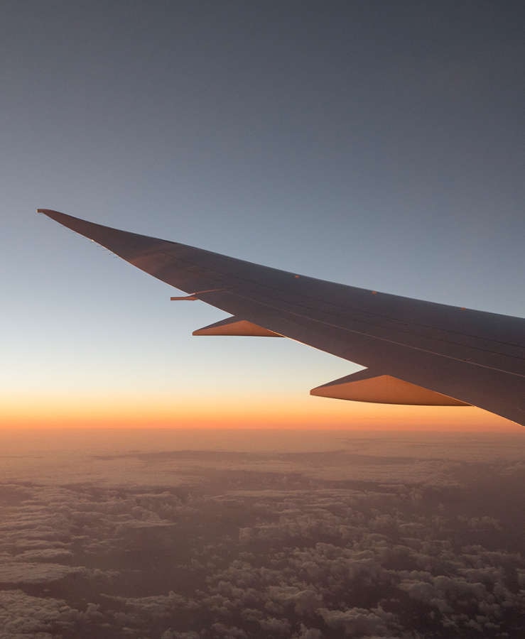 Aircraft wing over clouds