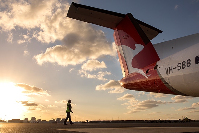 Qantas airplane tail at sunset