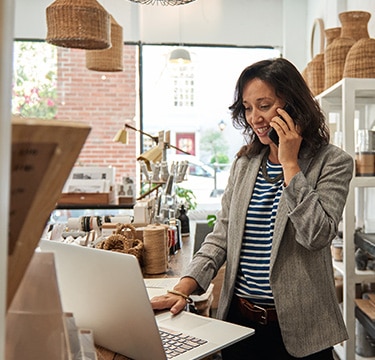 Lady on the phone at laptop