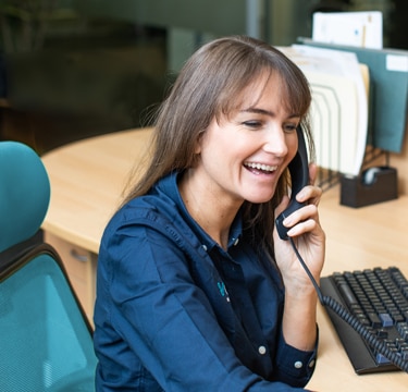 People in office talking on phones