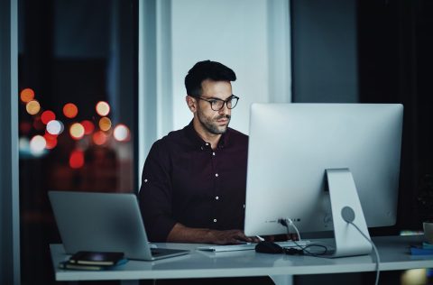 Office worker working late at a computer