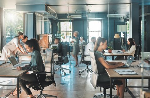 People working in an office meeting room