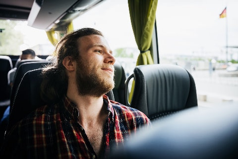 man sitting on bus