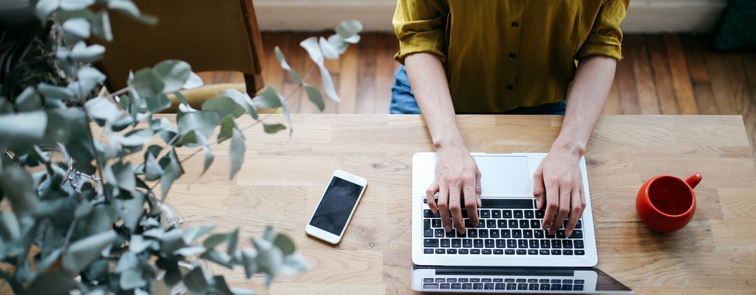 Overhead view of lady working on her laptop