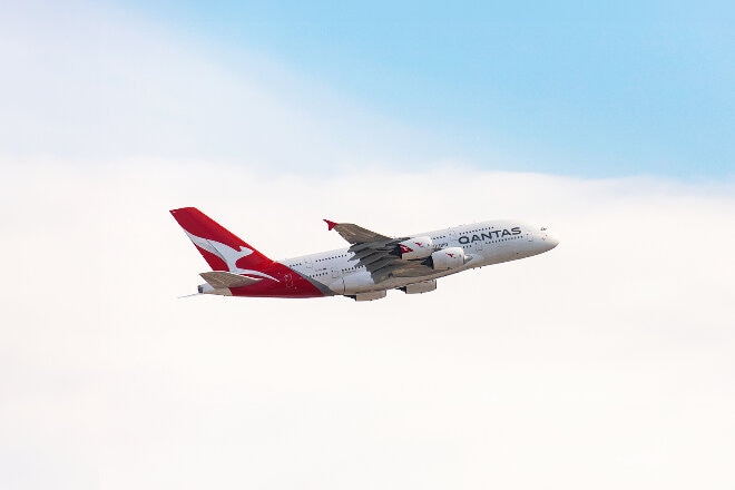 Qantas A380 taking off from Sydney airport on a blue sky day