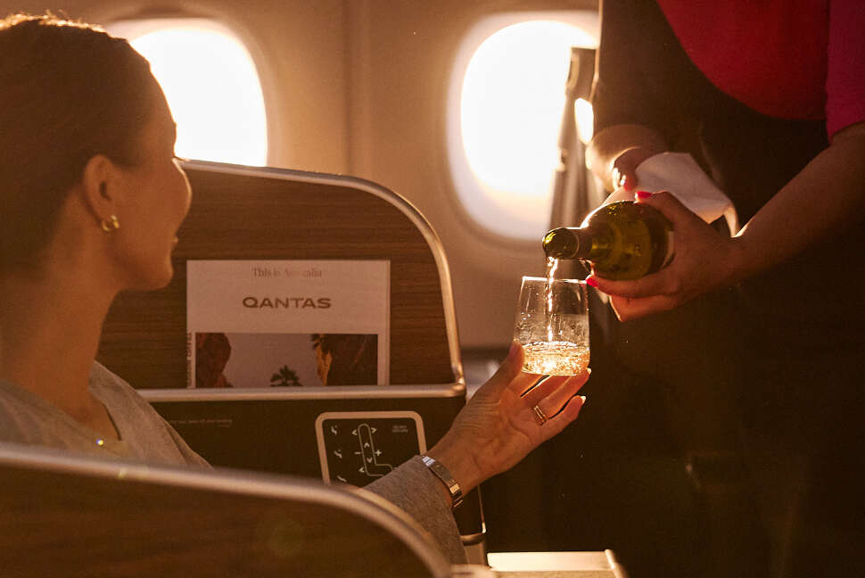 Settle into International Business in our signature Qantas pyjamas and enjoy inflight dining served by our cabin crew.