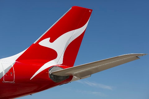 Qantas aircraft tail against blue sky